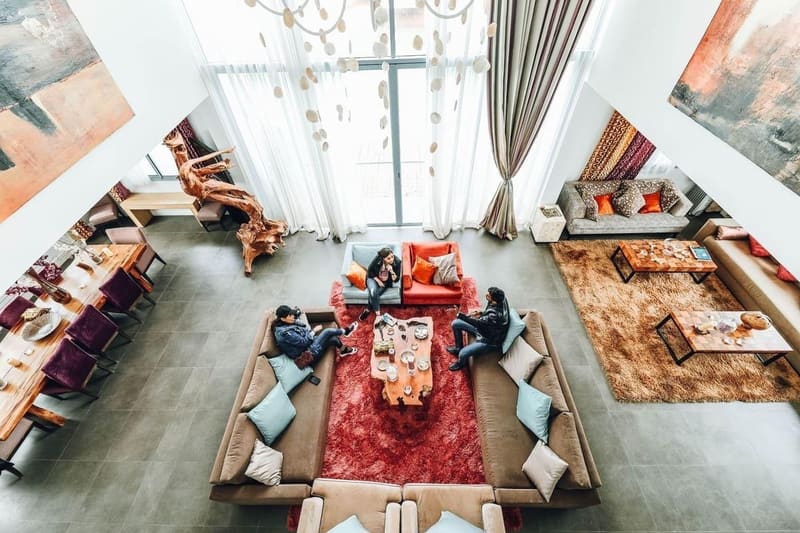 Spacious and elegant living room with modern furniture and decor, capturing a luxurious vibe.