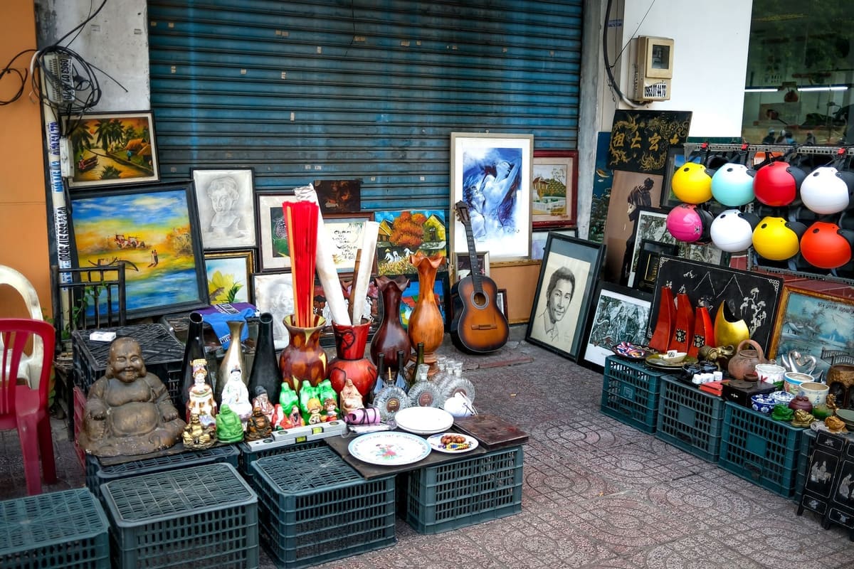 A vibrant mix of antiques, art, and decorations outside a thrift shop.